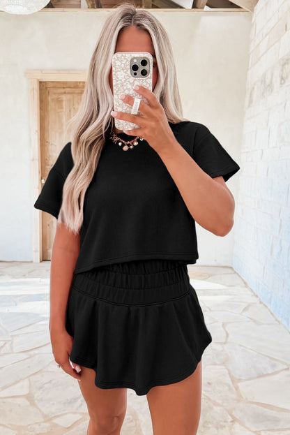 Black 2pcs Cropped Tee and Ruffle High Waist Skort Set.