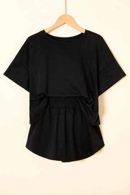 Black 2pcs Cropped Tee and Ruffle High Waist Skort Set.