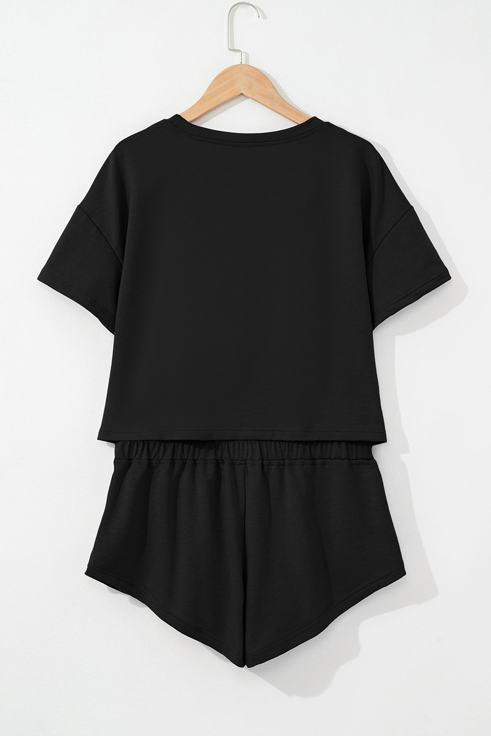 Black 2pcs Cropped Tee and Ruffle High Waist Skort Set.