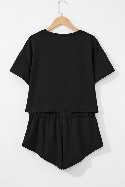 Black 2pcs Cropped Tee and Ruffle High Waist Skort Set.