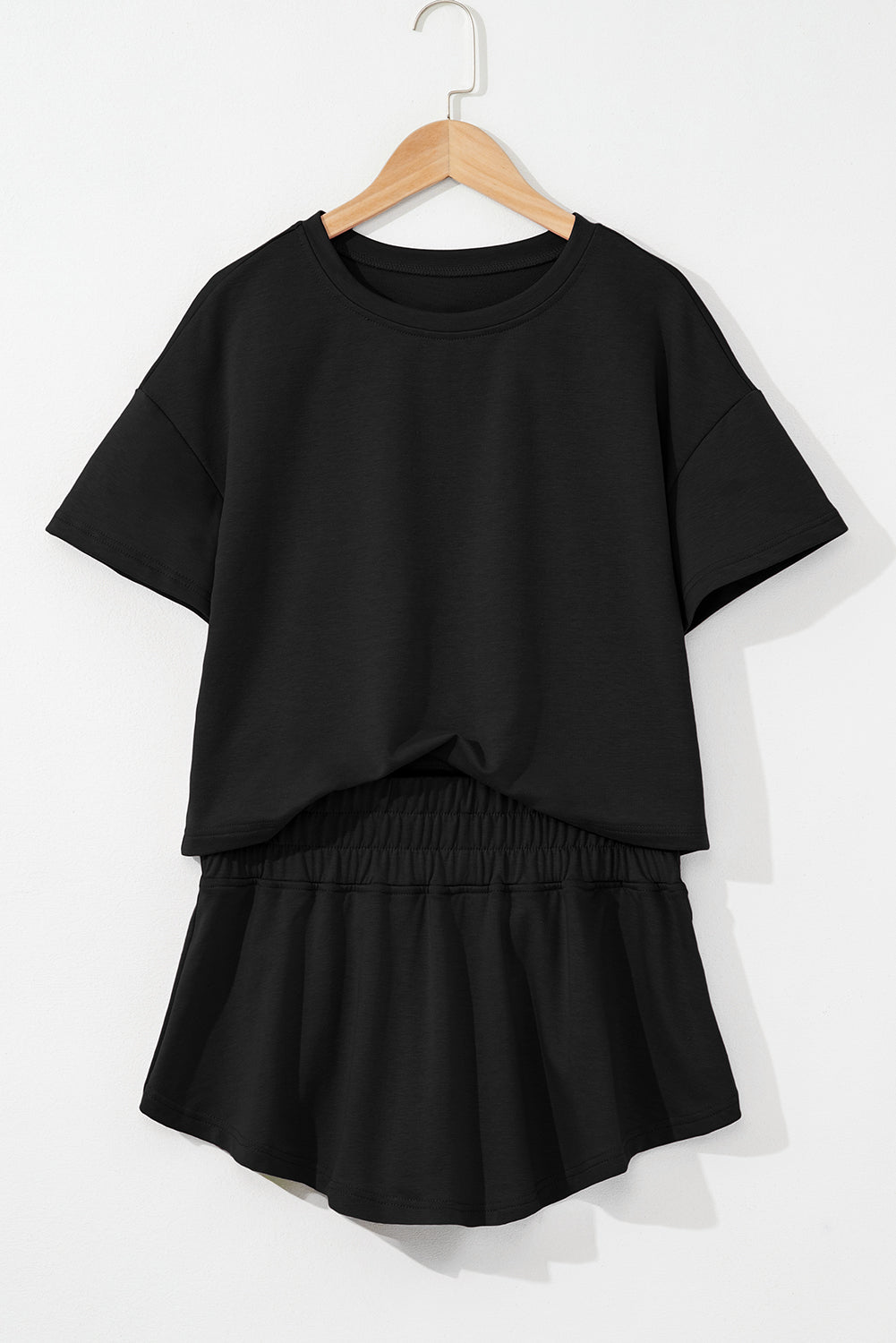 Black 2pcs Cropped Tee and Ruffle High Waist Skort Set.